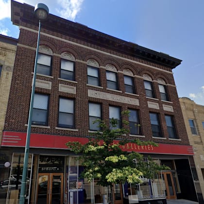 a building with a red awning that says "galleries" on it.