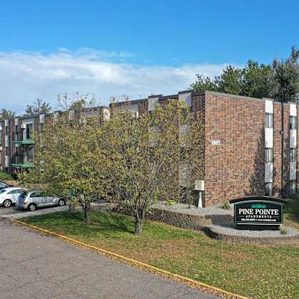 a parking lot in front of a pine pointe building.