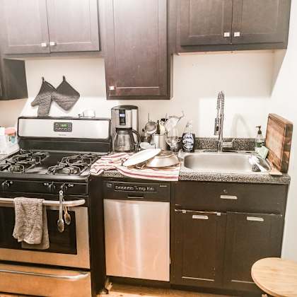 a kitchen with a black oven and a black dishwasher.