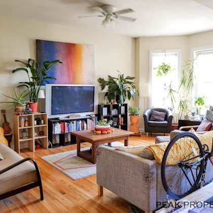 a living room with a bike in front of the tv