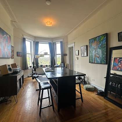 a room with a table and chairs in it.