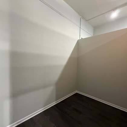 a corner of a room with a light on.