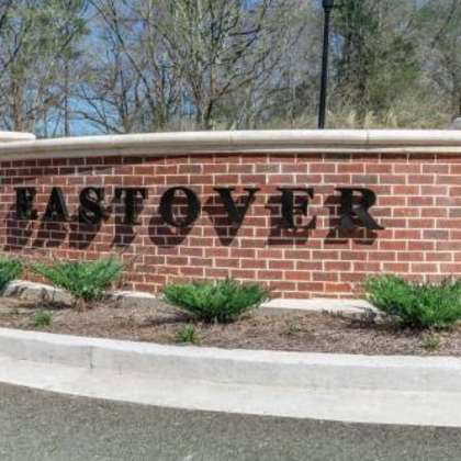 a brick sign on the side of a building