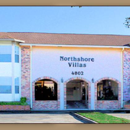 a building with the sign northshore villas 4802 on it.