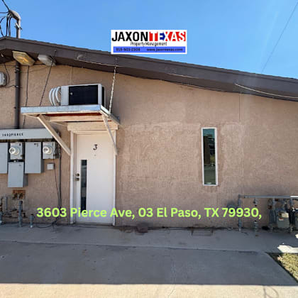 a building with a jaxonexas sign on top and a phone number below it.