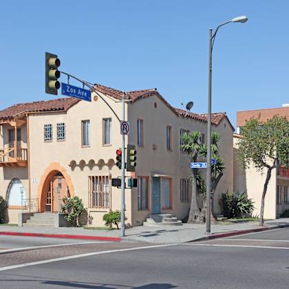 a street view of a building with a green traffic light.