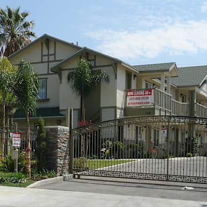 a gated community with a sign that says "new home open house".
