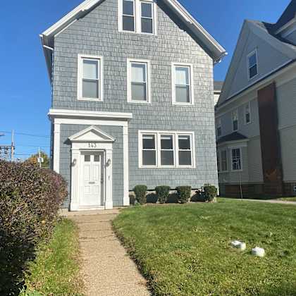 a house with a white door and windows.