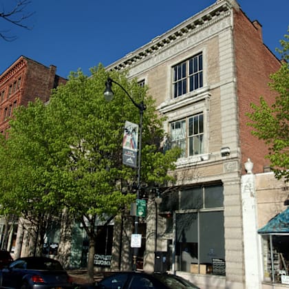 a street view of a building with a sign that says "consult".