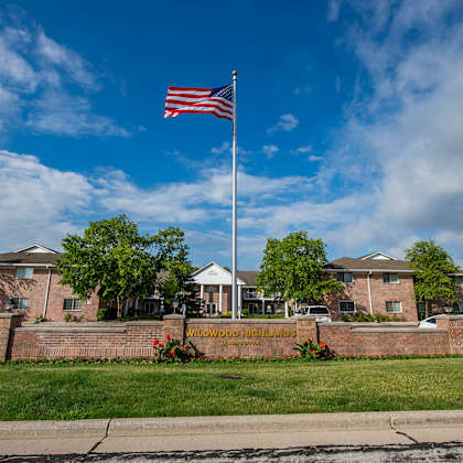 a flag is flying in front of a building with a sign that reads