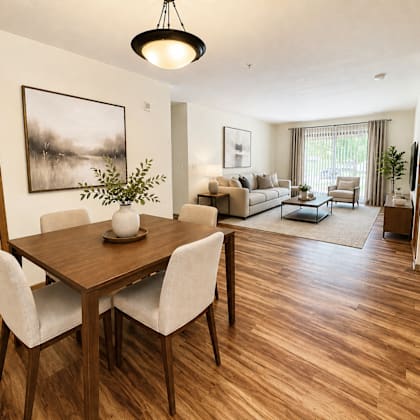 a dining room with a wooden table and chairs.