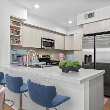 open-concept kitchen with energy-efficient appliances and countertop bar
