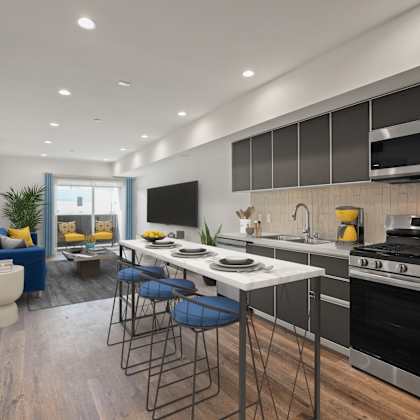 open-concept kitchen, dining, and living room with patio