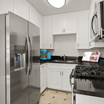 kitchen with stainless-steel refrigerator, stove, and microwave oven