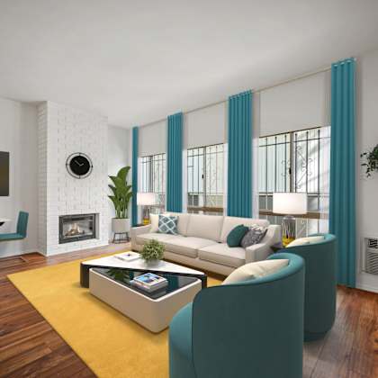 a modern living room with a white sofa, a coffee table, and a fireplace.