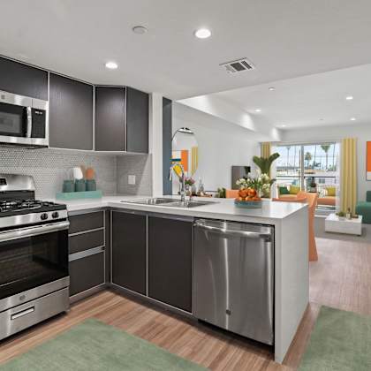 modern open-concept kitchen, sining, and living room with a patio