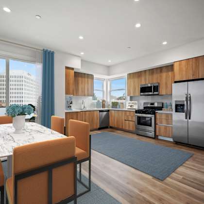 a kitchen and living room with a table and chairs