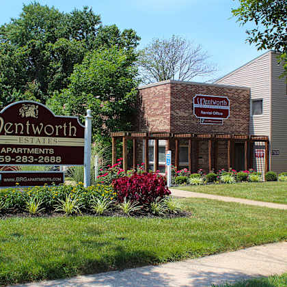 a building with a sign for a restaurant on the sidewalk at wentworth estates apartments, florence, ky, 41042