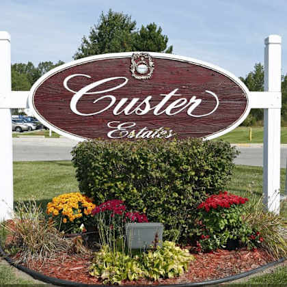 welcome sign at custer estates apartments, monroe