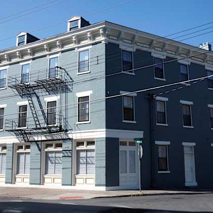 exterior of blue apartment building