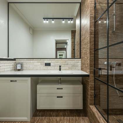 a bathroom with a white countertop and a white sink.