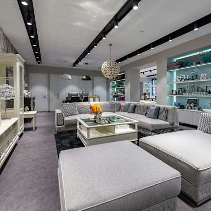 a modern furniture store with a variety of seating options.