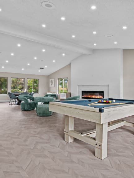 a game room with a pool table and a fireplace at Edge At Farmington Hills - Farmington Hills, MI, Farmington Hills, MI, 48334