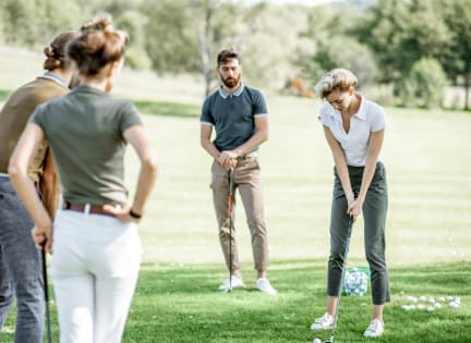 a group of people standing on the grass at Spring Meadow Apartments, Glendale