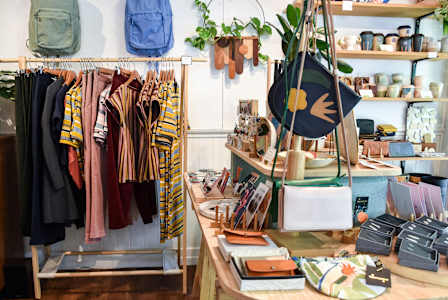 A clothing store with a variety of items on display. at Eagles Landing, Ammon, ID