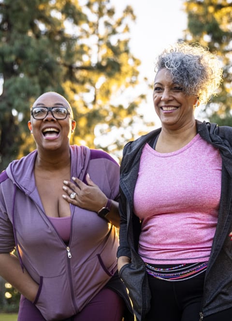 friends smiling at Brookwood at Oakdale 55+, New York
