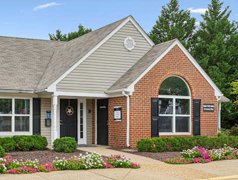 Leasing office exterior with native landscaping