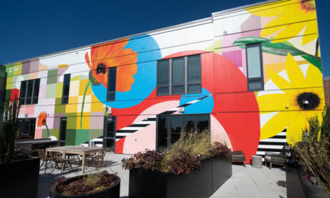 a colorful mural on the side of a building