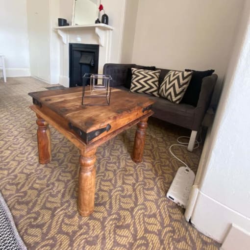 a living room with a coffee table and a couch