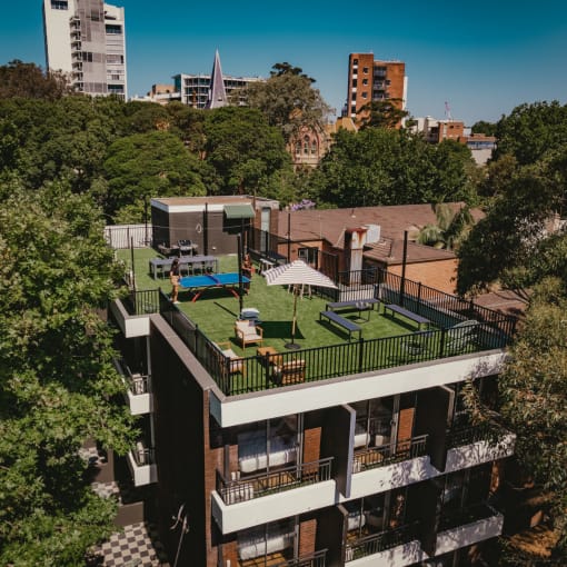 an aerial view of a building with a green roof