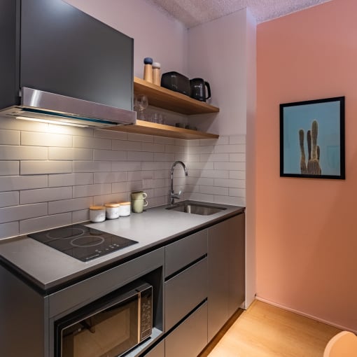 a small kitchen with a stove and a sink