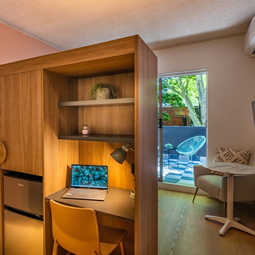 a home office with a desk and a laptop on a desk