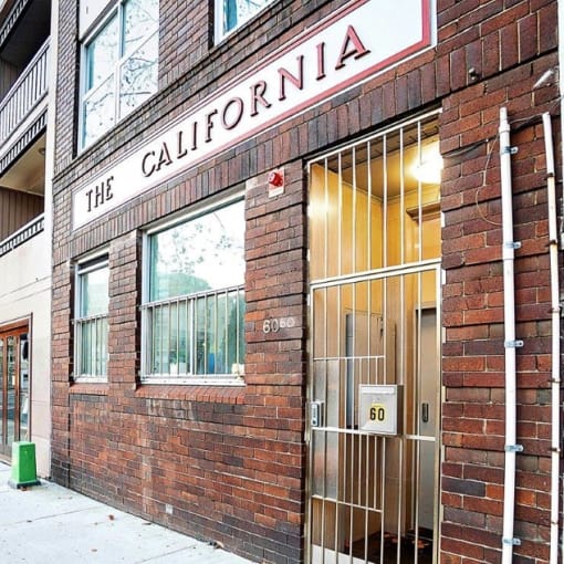 a brick building with a sign that reads the