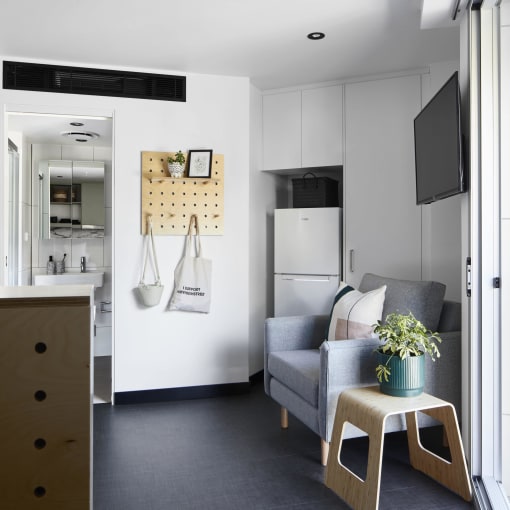 a living room and kitchen in a small apartment