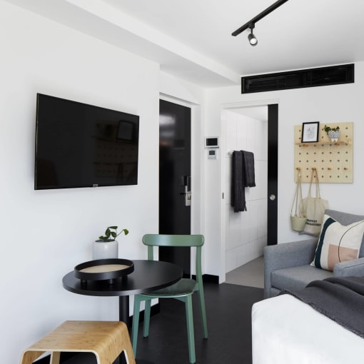 a living room with a couch and a table and a tv