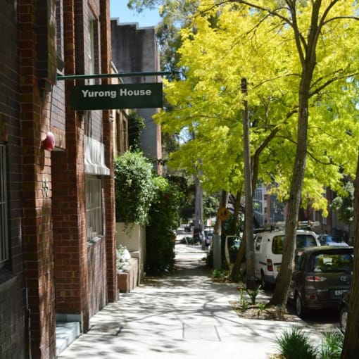 a street sign on the side of a brick building