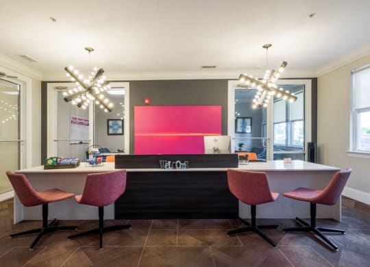 a kitchen and dining area with chairs and a counter at Linden on the GreeneWay, Florida, 32824