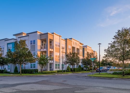 a street view of an apartment building with a parking lot at Linden on the GreeneWay, Florida, 32824