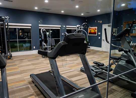 A gym with treadmills and exercise equipment. at Legends at Rancho Belago, Moreno Valley, CA, 92553