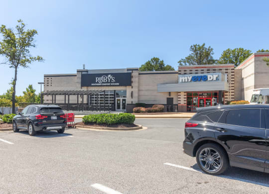 a parking lot with cars parked in front of a restaurant at Fairmont at South Lake, Bowie, MD, 20716