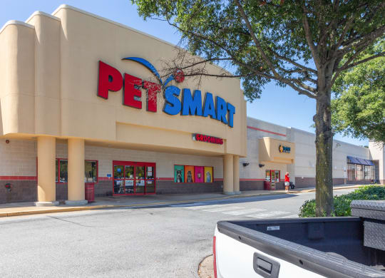 a pet smart store with a large tree in front of it at Fairmont at South Lake, Bowie, MD