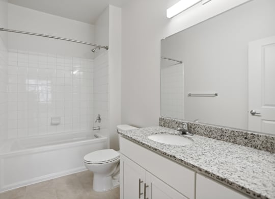 a bathroom with a toilet sink and bathtub at Fairmont at South Lake, Bowie, MD 20716