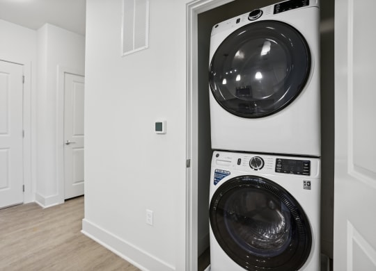 a washer and dryer in a laundry room at Fairmont at South Lake, Bowie Maryland