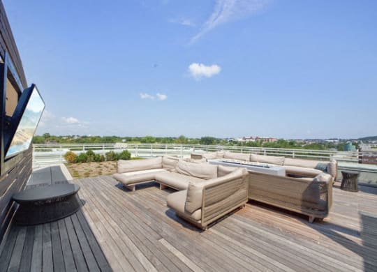 a terrace with couches and a table on a roof at Park Kennedy, Washington