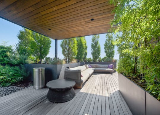 a patio with a couch and a table on a roof at Park Kennedy, Washington, 20003