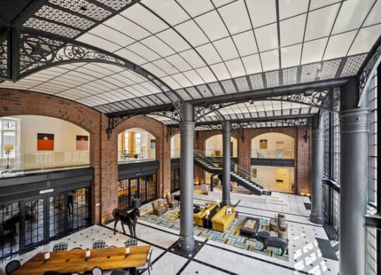 a view of the lobby of a large building with a ceiling and stairs at Park Kennedy, Washington